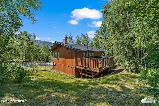 20213 David Ave, Eagle River, AK 99577 - rear view of house featuring a chimney and a deck with mountain view