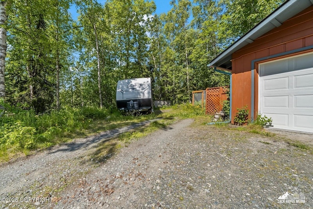 20213 David Ave, Eagle River, AK 99577 - view of property exterior with a garage