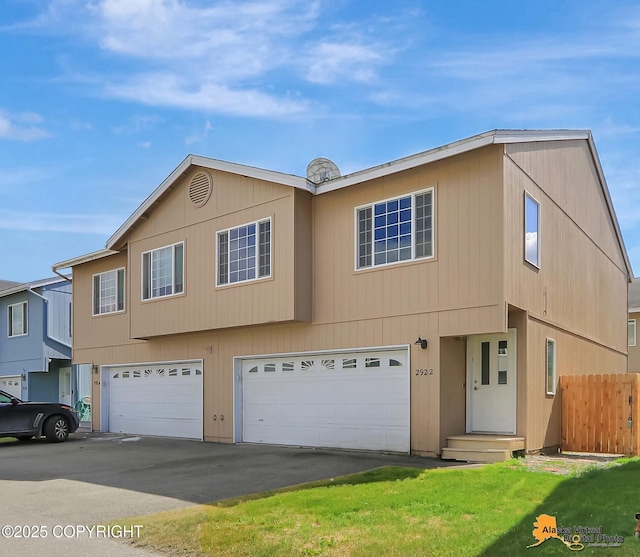 2922 Summer Sun Ct # 154, Anchorage, AK 99507 - townhome / multi-family property with an attached garage and asphalt driveway