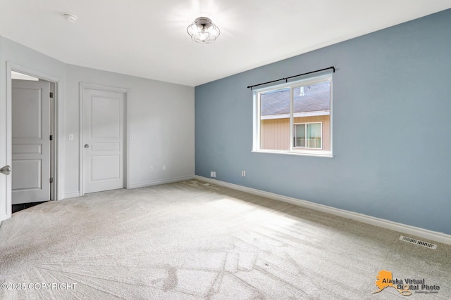 2922 Summer Sun Ct # 154, Anchorage, AK 99507 - empty room featuring carpet and a smoke detector