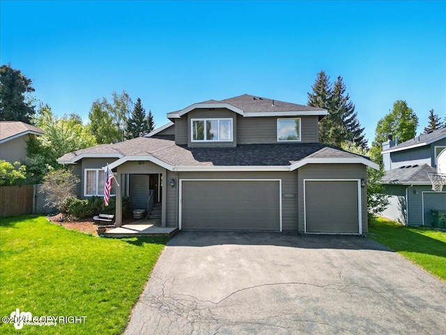 12830 Mission Cir, Anchorage, AK 99516 - view of front facade with asphalt driveway, roof with shingles, and a garage