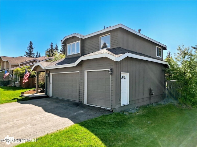 12830 Mission Cir, Anchorage, AK 99516 - view of front facade with an attached garage, a front lawn, and driveway