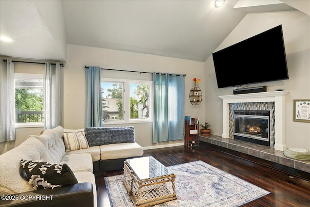 12830 Mission Cir, Anchorage, AK 99516 - living room with vaulted ceiling, hardwood / wood-style floors, plenty of natural light, and a tiled fireplace