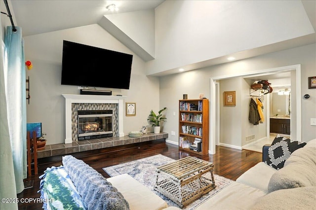 12830 Mission Cir, Anchorage, AK 99516 - living area with wood finished floors, a fireplace, baseboards, and high vaulted ceiling