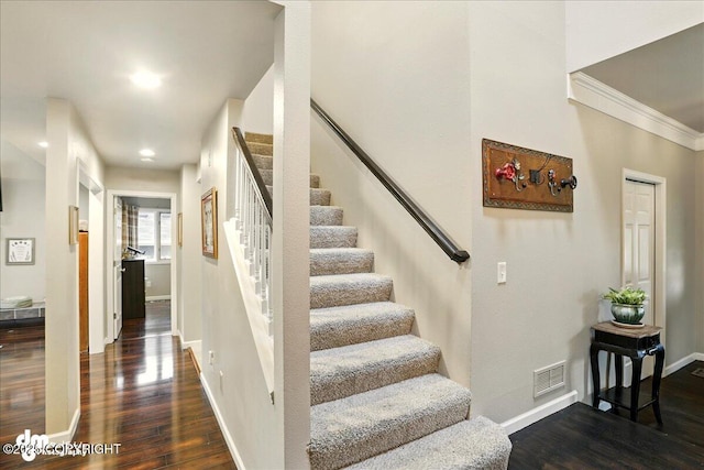 12830 Mission Cir, Anchorage, AK 99516 - staircase with wood finished floors, baseboards, crown molding, and recessed lighting