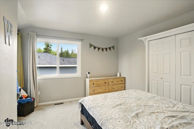 12830 Mission Cir, Anchorage, AK 99516 - bedroom with carpet floors, a closet, baseboards, and vaulted ceiling