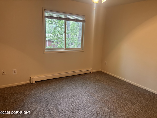 810 E 79th Ave, Anchorage, AK 99518 - spare room featuring a baseboard radiator and dark colored carpet