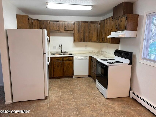 810 E 79th Ave, Anchorage, AK 99518 - kitchen featuring white appliances, a baseboard heating unit, under cabinet range hood, and light countertops