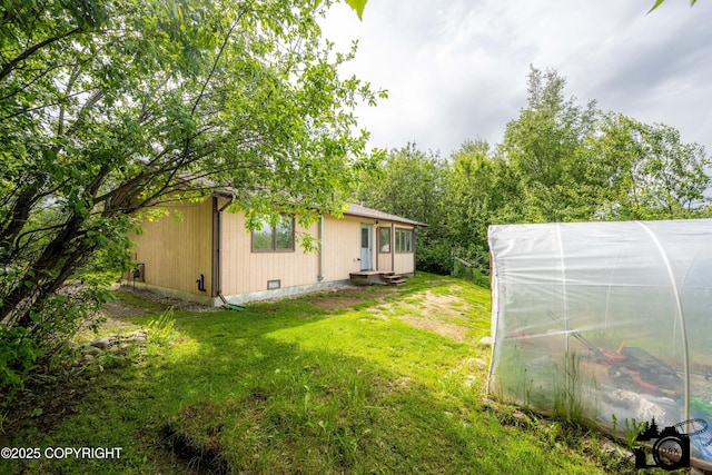 5275 E Birch Dr, Wasilla, AK 99654 - view of grassy yard featuring an exterior structure, an outbuilding, and entry steps