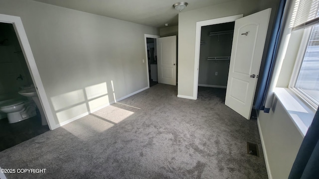 9074 W John St, Wasilla, AK 99654 - unfurnished bedroom with carpet flooring, a walk in closet, a closet, and connected bathroom