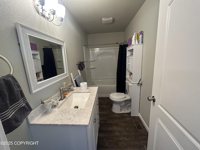 9074 W John St, Wasilla, AK 99654 - bathroom featuring vanity, wood finished floors, and shower / tub combo
