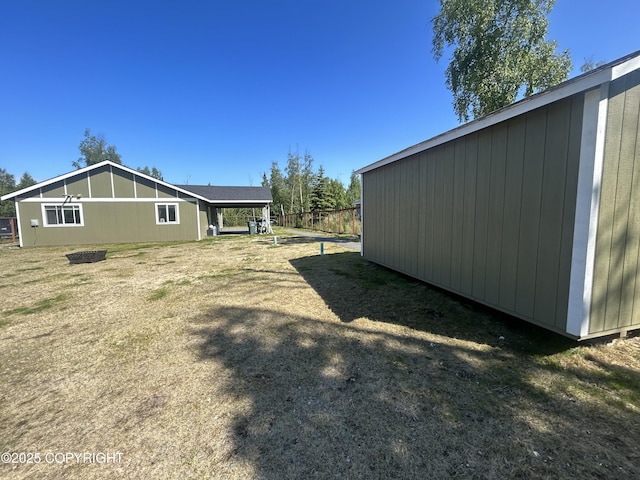 9074 W John St, Wasilla, AK 99654 - view of side of property featuring a carport