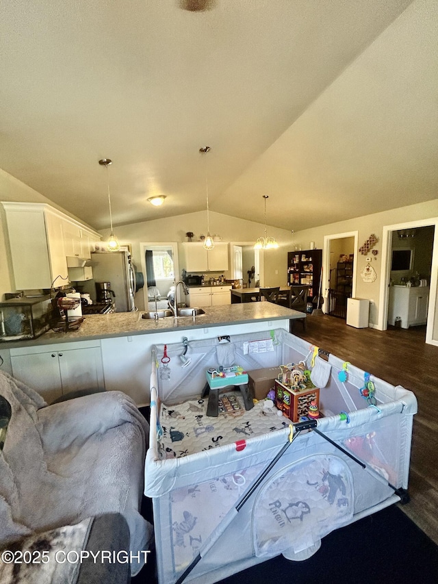 9074 W John St, Wasilla, AK 99654 - living room with dark wood-style flooring and vaulted ceiling