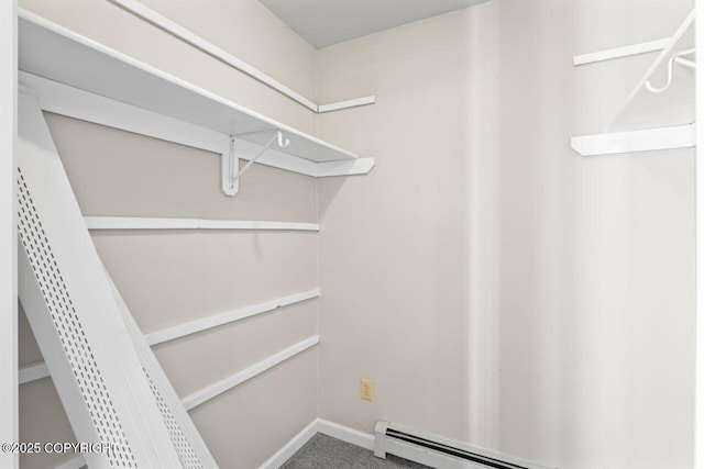 1100 Fred Cir, Anchorage, AK 99515 - walk in closet with a baseboard heating unit and carpet flooring