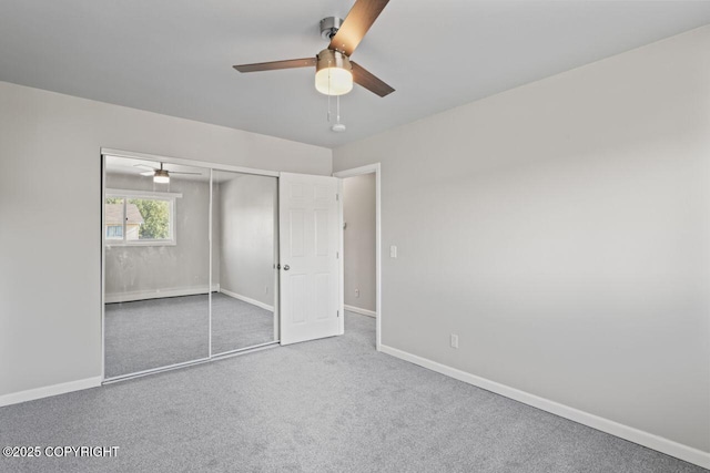 1100 Fred Cir, Anchorage, AK 99515 - unfurnished bedroom featuring carpet floors, a closet, baseboards, and a ceiling fan