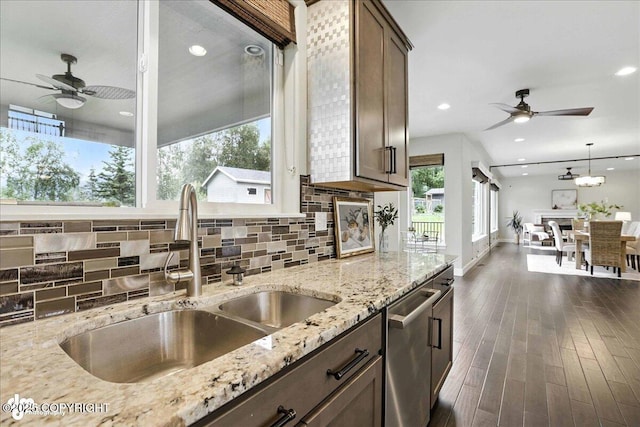 8683 Estates Cir, Anchorage, AK 99507 - kitchen featuring stainless steel dishwasher, ceiling fan, healthy amount of natural light, backsplash, and recessed lighting