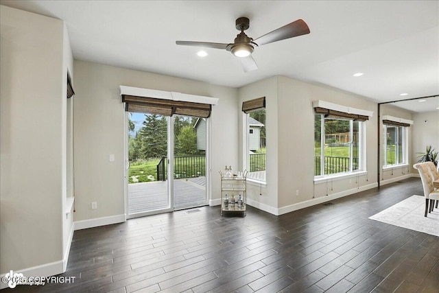 8683 Estates Cir, Anchorage, AK 99507 - living area with healthy amount of natural light, ceiling fan, dark wood finished floors, and recessed lighting