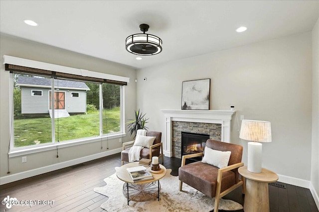 8683 Estates Cir, Anchorage, AK 99507 - living area featuring hardwood / wood-style floors, a fireplace, and recessed lighting
