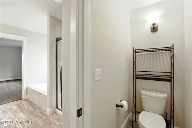 8683 Estates Cir, Anchorage, AK 99507 - full bath featuring a stall shower, a garden tub, and wood finished floors