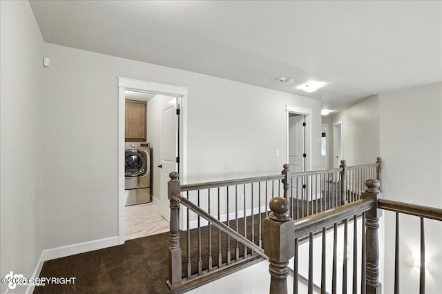 8683 Estates Cir, Anchorage, AK 99507 - hallway with an upstairs landing, washer / clothes dryer, and marble finish flooring