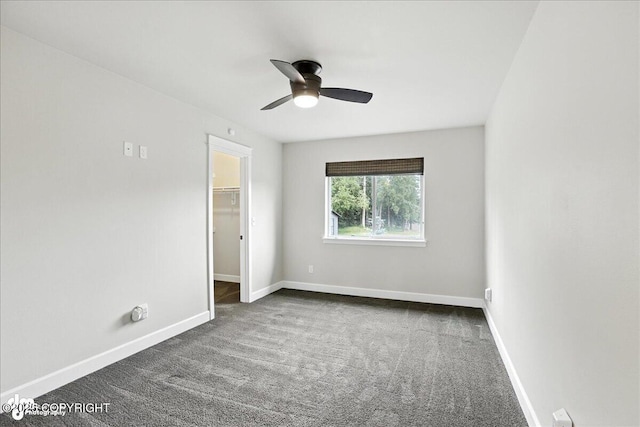 8683 Estates Cir, Anchorage, AK 99507 - unfurnished room featuring dark colored carpet and a ceiling fan