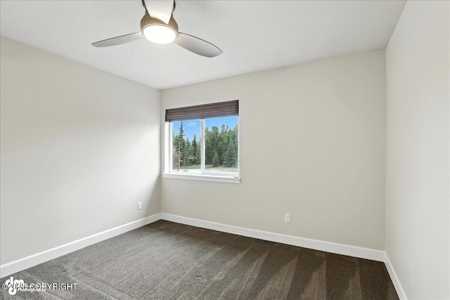 8683 Estates Cir, Anchorage, AK 99507 - empty room with a ceiling fan and dark carpet