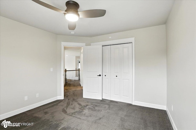 8683 Estates Cir, Anchorage, AK 99507 - unfurnished bedroom with carpet floors, a closet, and a ceiling fan