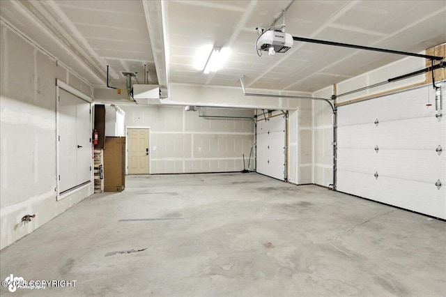 8683 Estates Cir, Anchorage, AK 99507 - garage featuring a garage door opener