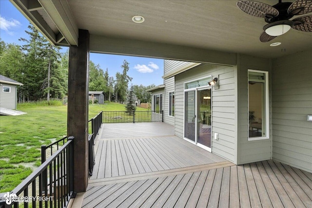 8683 Estates Cir, Anchorage, AK 99507 - wooden terrace with ceiling fan and a lawn