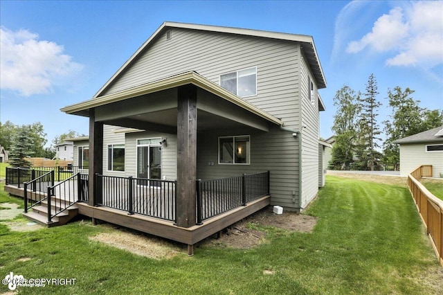 8683 Estates Cir, Anchorage, AK 99507 - back of house with a lawn and a deck