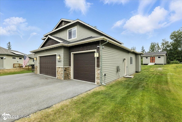 8683 Estates Cir, Anchorage, AK 99507 - view of property exterior with a yard, asphalt driveway, and stone siding