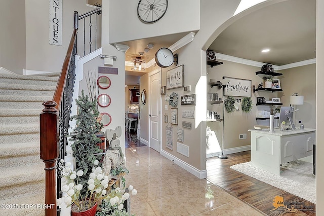 2548 S Gallop Cir, Wasilla, AK 99654 - entryway featuring arched walkways, ornamental molding, and stairs