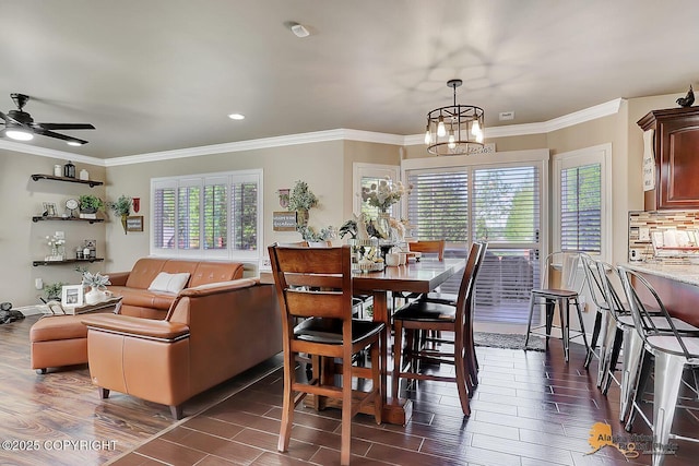 2548 S Gallop Cir, Wasilla, AK 99654 - dining space with dark wood-style flooring, a chandelier, ornamental molding, a ceiling fan, and recessed lighting