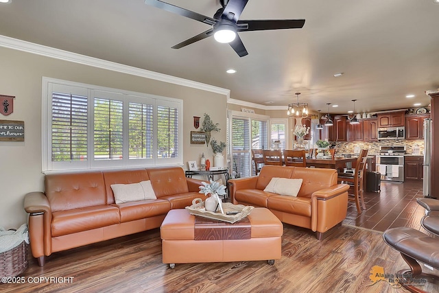 2548 S Gallop Cir, Wasilla, AK 99654 - living area featuring ornamental molding, dark wood-style floors, a ceiling fan, recessed lighting, and a chandelier