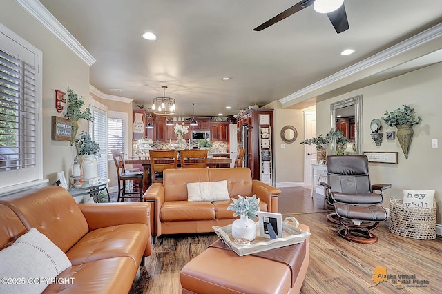 2548 S Gallop Cir, Wasilla, AK 99654 - living room with a chandelier, ceiling fan, ornamental molding, recessed lighting, and wood finished floors
