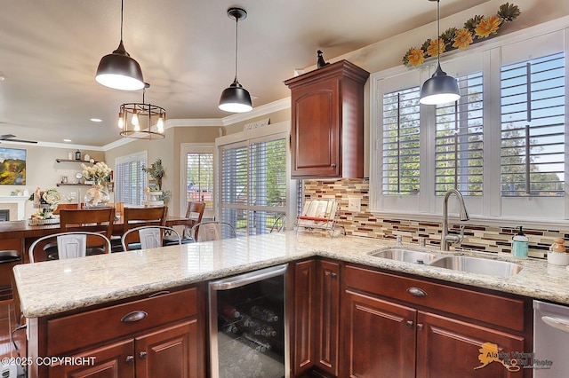 2548 S Gallop Cir, Wasilla, AK 99654 - kitchen with wine cooler, backsplash, dishwasher, ornamental molding, and light stone countertops