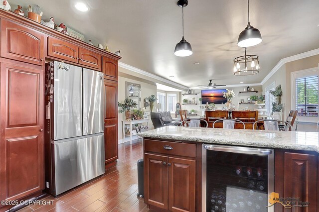 2548 S Gallop Cir, Wasilla, AK 99654 - kitchen with freestanding refrigerator, beverage cooler, ornamental molding, a ceiling fan, and dark wood-type flooring