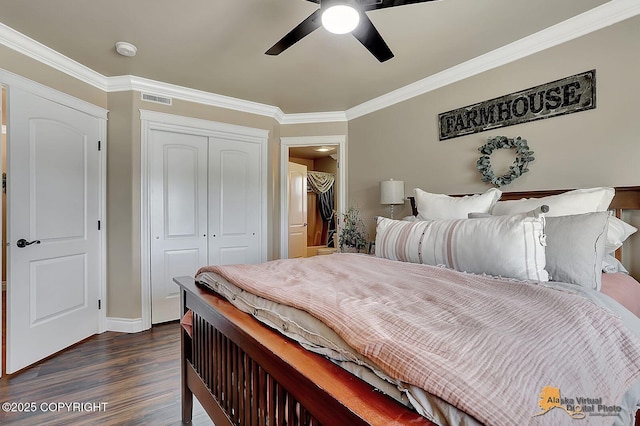 2548 S Gallop Cir, Wasilla, AK 99654 - bedroom featuring dark wood-type flooring, a closet, crown molding, and ceiling fan
