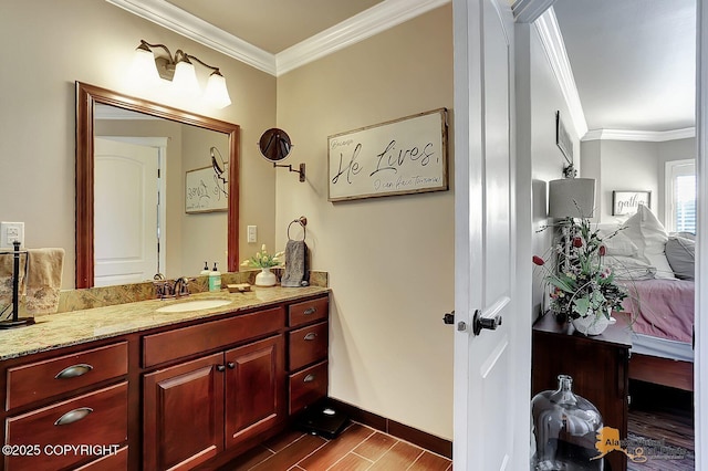 2548 S Gallop Cir, Wasilla, AK 99654 - bathroom with vanity, ornamental molding, wood finished floors, and connected bathroom