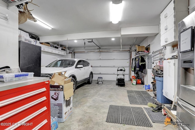 2548 S Gallop Cir, Wasilla, AK 99654 - garage featuring a garage door opener