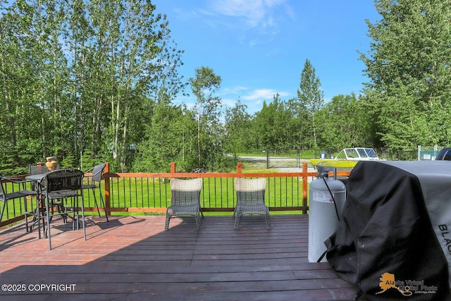 2548 S Gallop Cir, Wasilla, AK 99654 - deck featuring grilling area, a yard, and outdoor dining space