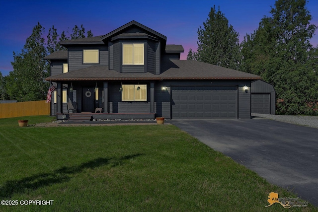 2548 S Gallop Cir, Wasilla, AK 99654 - traditional home featuring a garage, a porch, and driveway