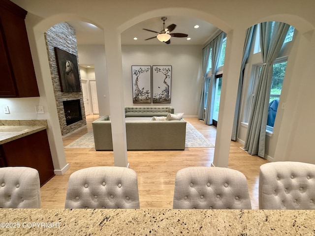 14740 Maxwell Pl, Anchorage, AK 99516 - living room with a ceiling fan, a fireplace, baseboards, and recessed lighting