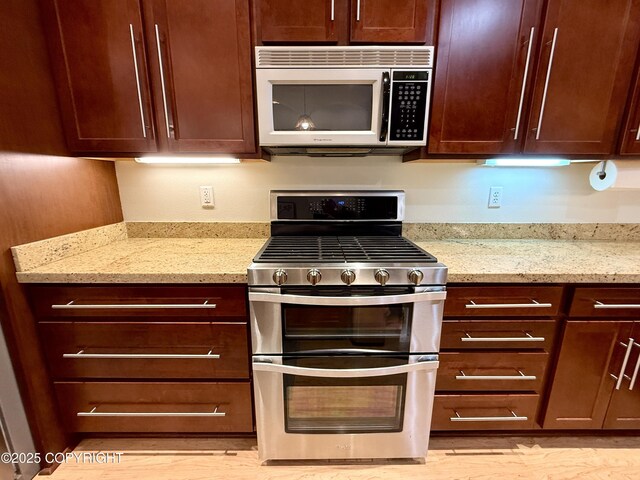 14740 Maxwell Pl, Anchorage, AK 99516 - kitchen featuring stainless steel appliances, light stone counters, and light wood-style flooring