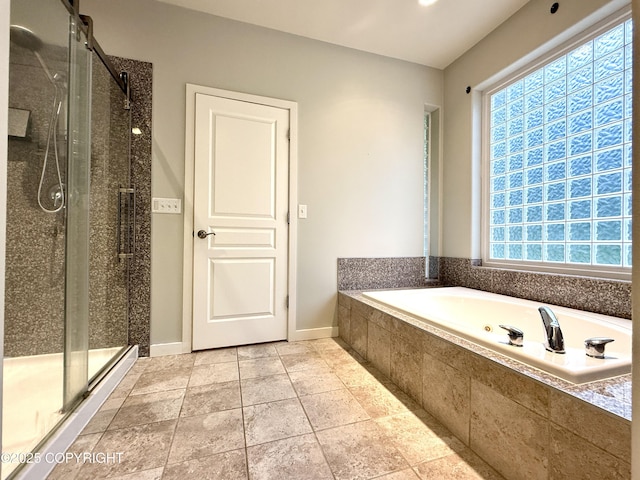 14740 Maxwell Pl, Anchorage, AK 99516 - bathroom featuring a bath, a stall shower, and baseboards