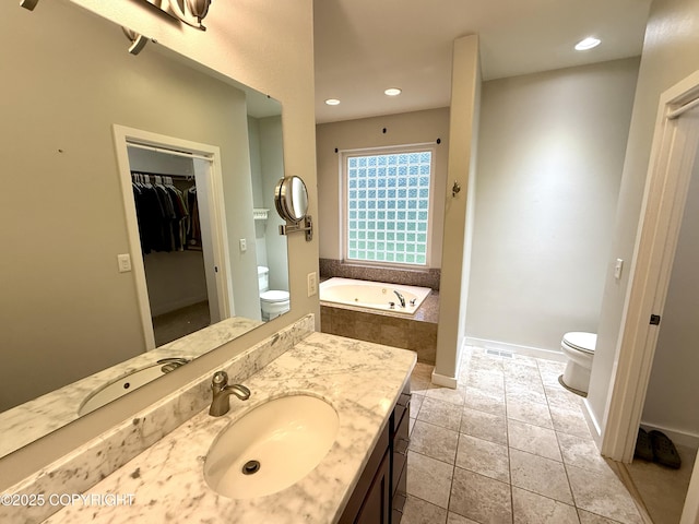 14740 Maxwell Pl, Anchorage, AK 99516 - full bathroom featuring toilet, vanity, a bath, a spacious closet, and recessed lighting