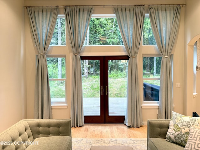 14740 Maxwell Pl, Anchorage, AK 99516 - entryway featuring french doors, light wood-type flooring, and arched walkways