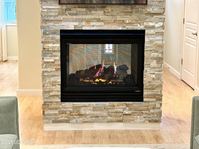14740 Maxwell Pl, Anchorage, AK 99516 - detailed view of a fireplace, baseboards, and wood finished floors