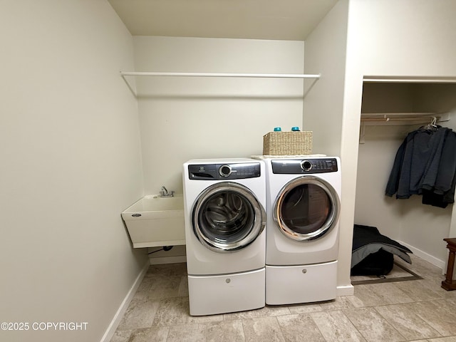 14740 Maxwell Pl, Anchorage, AK 99516 - washroom featuring washer and clothes dryer and baseboards