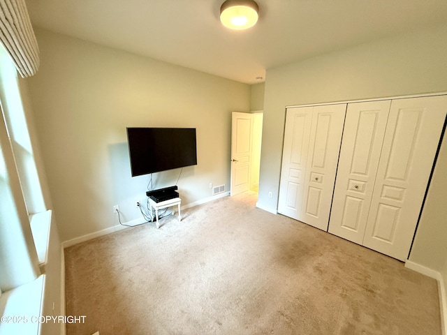 14740 Maxwell Pl, Anchorage, AK 99516 - unfurnished bedroom featuring carpet, a closet, and baseboards